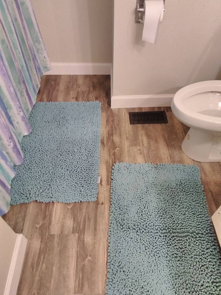 Bathroom with new wood-look vinyl flooring